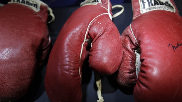 Ali's gloves from 1965 bout and rare signed photo of Shoeless Joe up for auction Article Image 0, The Canadian Press Ali's gloves from 1965 bout and rare signed photo of Shoeless Joe up for auction Article Image 0