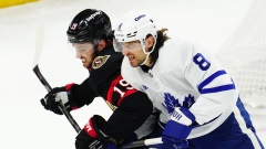 Drake Batherson and Chris Tanev