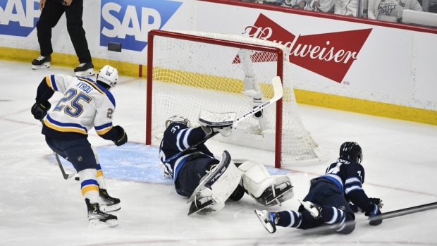 Lowry nets winner in double OT as Jets beat Blues 4-3 in Game 7 thriller Article Image 0, The Canadian Press Lowry nets winner in double OT as Jets beat Blues 4-3 in Game 7 thriller Article Image 0