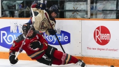 Ottawa Charge and Montreal Victoire battle for puck