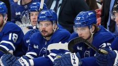 Mitch Marner (behind), Auston Matthews, Matthew Knies