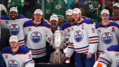 Edmonton Oilers pose with Clarence S. Campbell Bowl