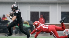 Dustin Crum evades Clarence Hicks