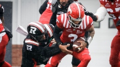 Jovan Santos-Knox tackles Vernon Adams Jr.