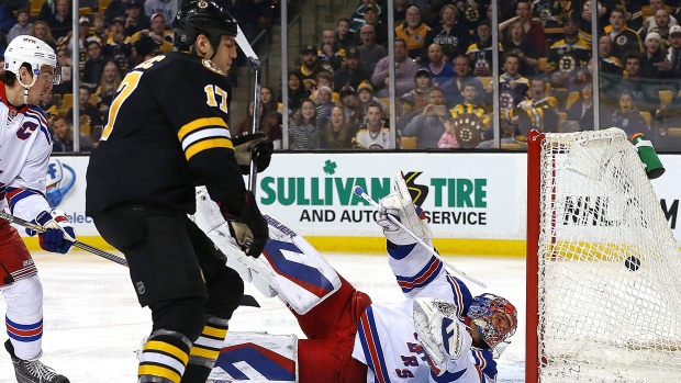 Milan Lucic scores on Henrik Lundqvist, Jim Rogash/Getty Images Milan Lucic scores on Henrik Lundqvist