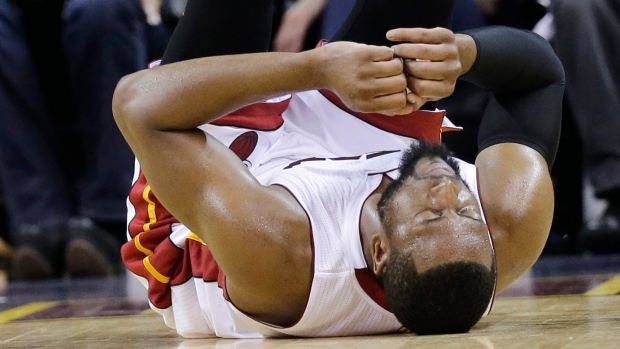 The Cleveland Cavaliers' Dwyane Wade takes a moment while medical