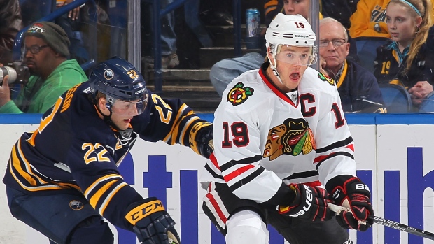 Jonathan Toews and Johan Larsson