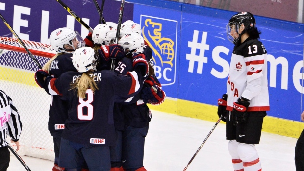 U.S. players celebrate, The Canadian Press U.S. players celebrate