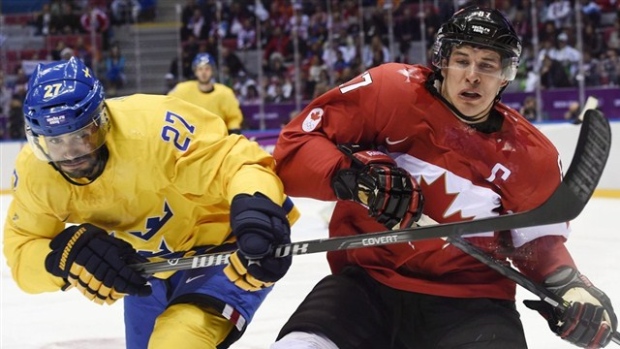 Johnny Oduya and Sidney Crosby, The Canadian Press Johnny Oduya and Sidney Crosby