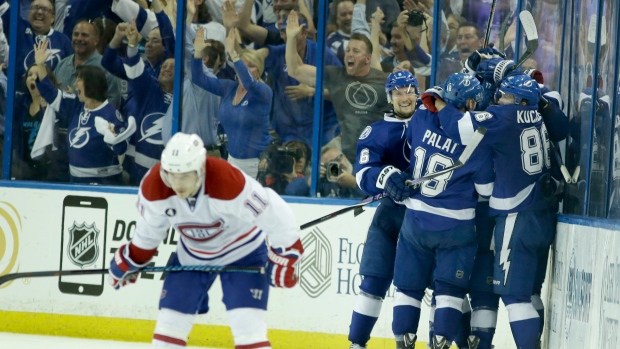 Lightning celebrate behind Gallagher, The Canadian Press Lightning celebrate behind Gallagher