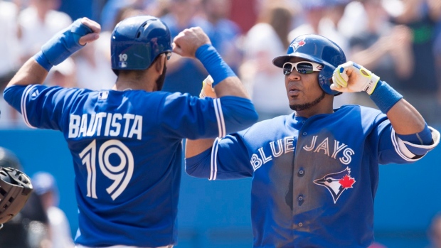 Bautista and Encarnacion, The Canadian Press Bautista and Encarnacion
