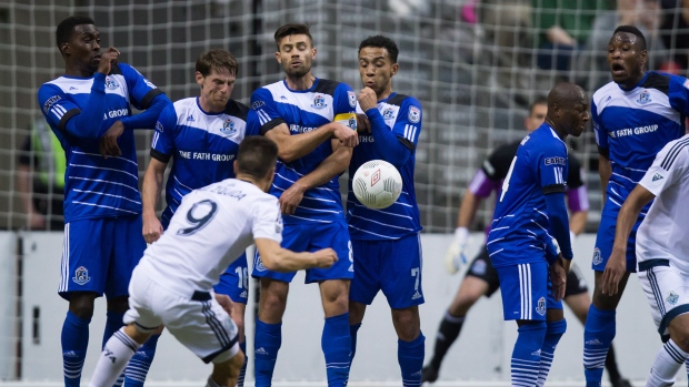 Edmonton FC players block Mezquida's kick