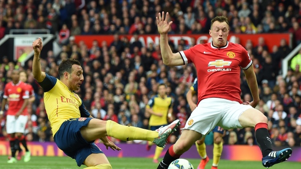 Santi Cazorla and Phil Jones, PAUL ELLIS/AFP/Getty Images Santi Cazorla and Phil Jones