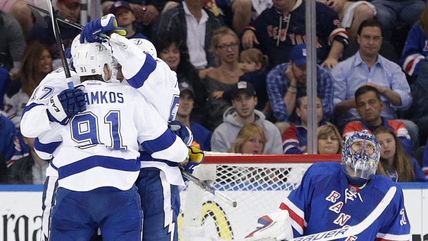 Lightning celebrate in front of Lundqvist, The Canadian Press Lightning celebrate in front of Lundqvist