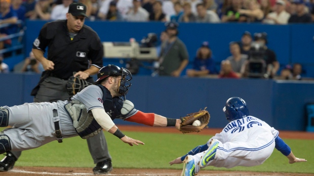 Josh Donaldson slides past Yan Gomes