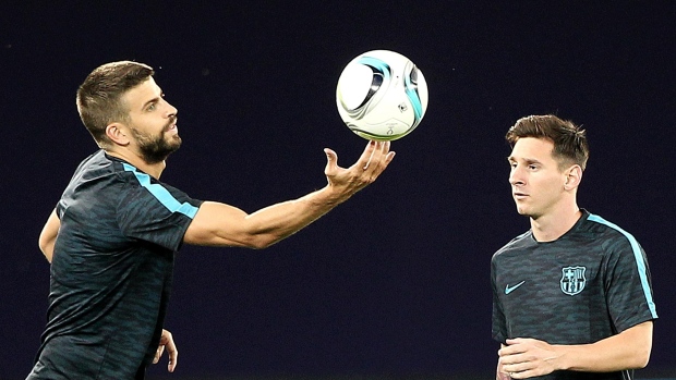 Gerard Pique and Lionel Messi