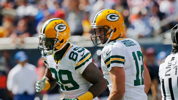 James Jones and Aaron Rodgers, The Canadian Press James Jones and Aaron Rodgers