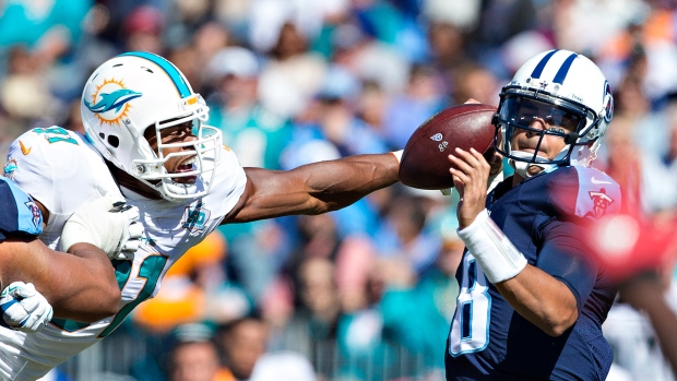 Marcus Mariota and Cameron Wake, Wesley Hitt/Getty Images Marcus Mariota and Cameron Wake