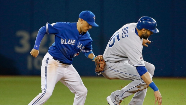 Ryan Goins tags out Alex Rios, The Canadian Press Ryan Goins tags out Alex Rios
