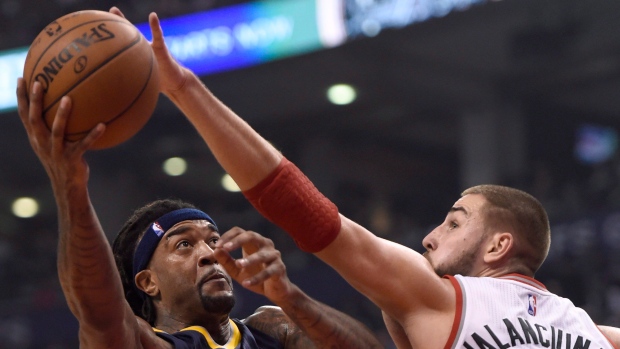 Jordan Hill and Jonas Valanciunas , The Canadian Press Jordan Hill and Jonas Valanciunas