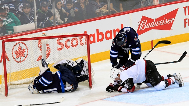 Ondrej Pavelec goes down injured, Darcy Finley/National Hockey League/Getty Images Ondrej Pavelec goes down injured