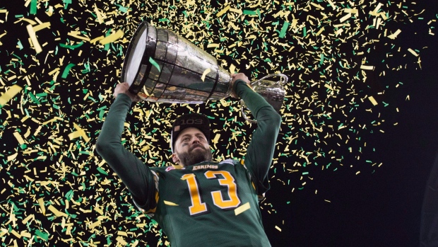 Mike Reilly hoists the Grey Cup, The Canadian Press Mike Reilly hoists the Grey Cup