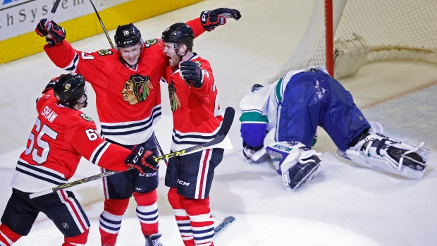 Dennis Rasmussen celebrates a goal against Ryan Miller, The Canadian Press Dennis Rasmussen celebrates a goal against Ryan Miller