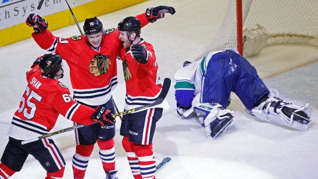 Dennis Rasmussen celebrates a goal against Ryan Miller