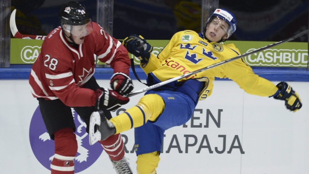 Lawson Crouse hits Gustav Forsling, The Canadian Press Lawson Crouse hits Gustav Forsling