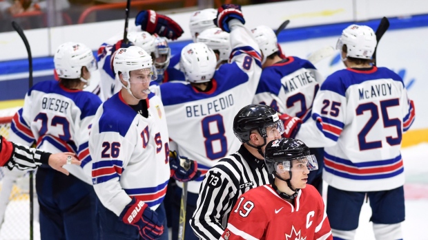 Team USA celebrates in front of Brayden Point, The Canadian Press Team USA celebrates in front of Brayden Point