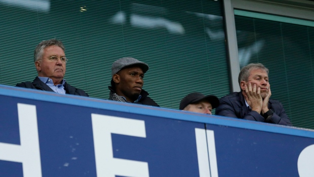 Guus Hiddink, Didier Drogba and Roman Abramovich, The Canadian Press Guus Hiddink, Didier Drogba and Roman Abramovich