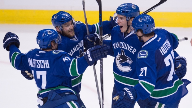 Vancouver Canucks celebrate, The Canadian Press Vancouver Canucks celebrate