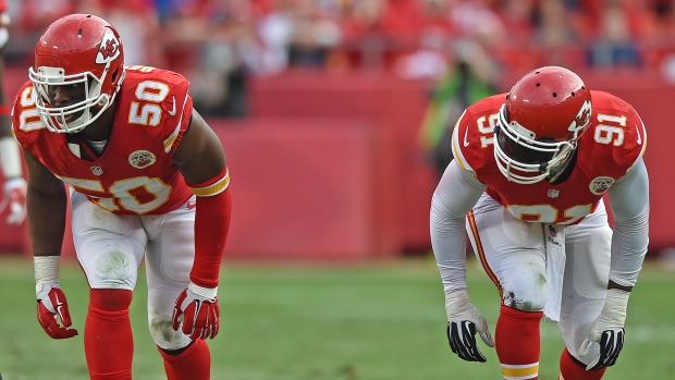 Joustin Houston and Tamba Hali, Peter G. Aiken/Getty Images Joustin Houston and Tamba Hali