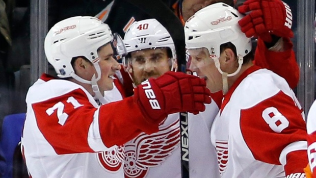 Dylan Larkin, Henrik Zetterberg, and Justin Abdelkader