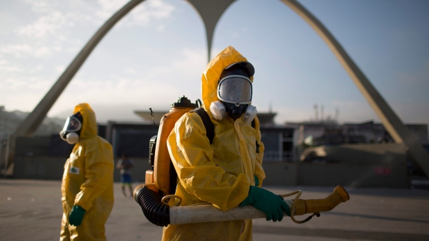 A health worker stands in the Sambadrome as he sprays insecticide to combat the Aedes aegypti mosqui