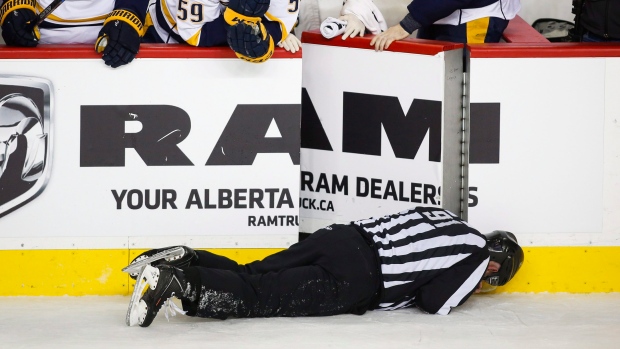 Don Henderson lies prone following collision with Dennis Wideman