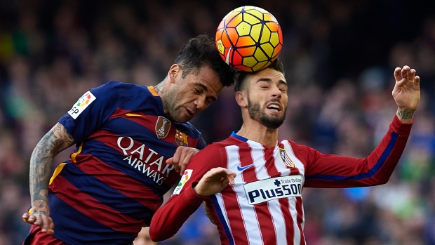 Daniel Alves and Yannick Carrasco, Manuel Queimadelos Alonso/Getty Images Daniel Alves and Yannick Carrasco
