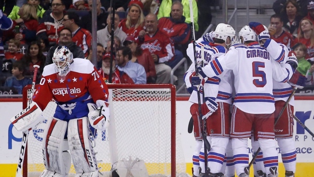 Rangers celebrate behind Holtby, The Canadian Press Rangers celebrate behind Holtby