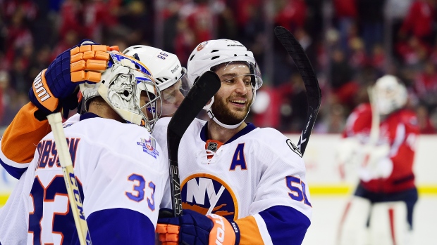 Islanders celebrate, Patrick McDermott/National Hockey League/Getty Images Islanders celebrate