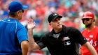 Home plate umpire Dan Iassogna and Blue Jays manager John Gibbons