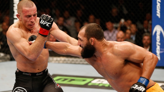 Johny Hendricks and Georges St-Pierre, Josh Hedges/Zuffa LLC/UFC/Getty Images Johny Hendricks and Georges St-Pierre