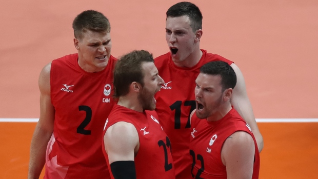 Canadian volleyball players celebrate