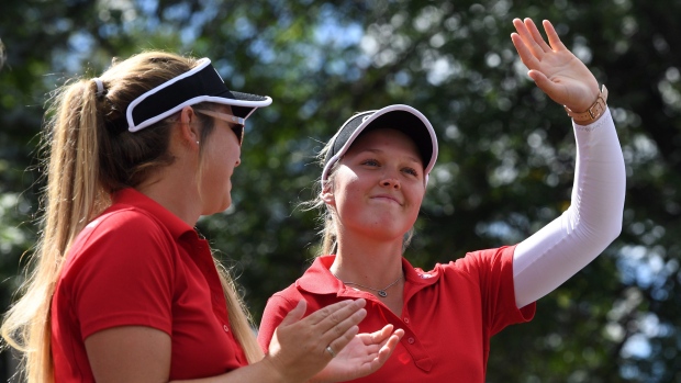 Brooke Henderson and sister/caddie Brittany Henderson, The Canadian Press Brooke Henderson and sister/caddie Brittany Henderson