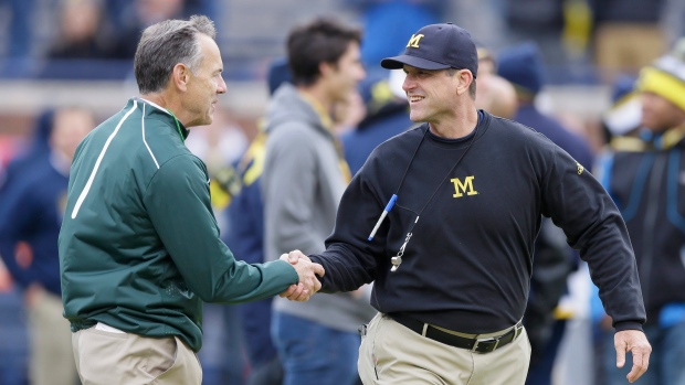 Mark Dantonio, left, and Jim Harbaugh, The Canadian Press Mark Dantonio, left, and Jim Harbaugh
