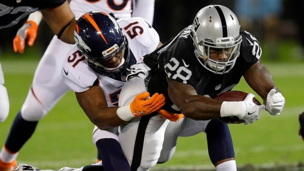Latavius Murray & Todd Davis, The Canadian Press Latavius Murray & Todd Davis