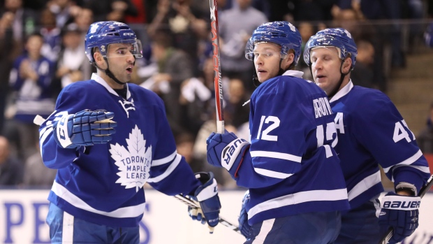 Connor Brown, Nazem Kadri and Leo Komarov celebrate