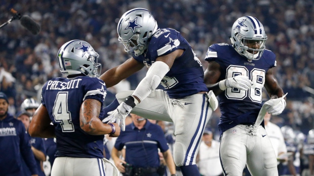 Prescott, Elliott and Bryant celebrate