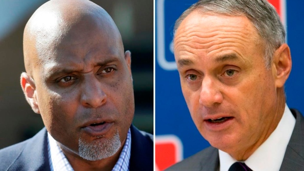 Tony Clark and Rob Manfred, The Canadian Press Tony Clark and Rob Manfred