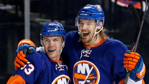 Casey Cizikas and Scott Mayfield celebrate