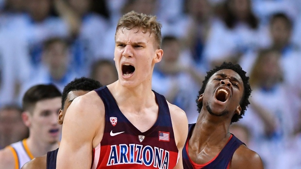 Lauri Markkanen and Kobi Simmons, The Canadian Press Lauri Markkanen and Kobi Simmons